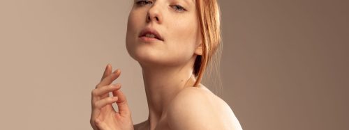 Portrait,Of,Young,Beautiful,Red-haired,Girl,Isolated,Over,Grey,Studio